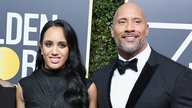 Simone Johnson, who goes by Ava Raine on the wrestling mat, with her father Dwayne “The Rock” Johnson on a red carpet