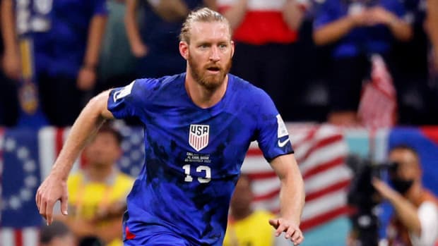 United States of America defender Tim Ream dribbles the ball against England.