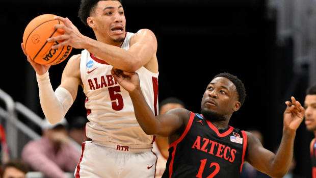Mar 24, 2023; Louisville, KY, USA; Alabama Crimson Tide guard Jahvon Quinerly (5) looks to pass against San Diego State Aztecs guard Darrion Trammell (12) during the first half of the NCAA tournament round of sixteen at KFC YUM! Center. Mandatory Credit: Jamie Rhodes-USA TODAY Sports
