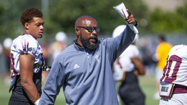 The Arizona State University football team practices in Tempe, Monday, August 19, 2019. Defensive line assistant coach Jamar Cain barks out instructions. Asu