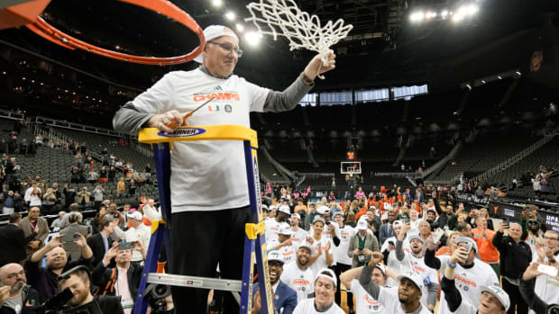 Miami head coach Jim Larranaga celebrates during the net cutting after their win against Texas in an Elite 8 college basketball game in the Midwest Regional of the NCAA Tournament Sunday, March 26, 2023, in Kansas City, Mo. (AP Photo/Charlie Riedel)