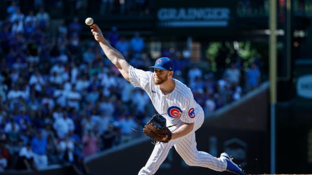 Aug 10, 2022; Chicago, Illinois, USA; Chicago Cubs relief pitcher Rowan Wick (50) delivers against the Washington Nationals during the ninth inning at Wrigley Field. Mandatory Credit: Kamil Krzaczynski-USA TODAY Sports