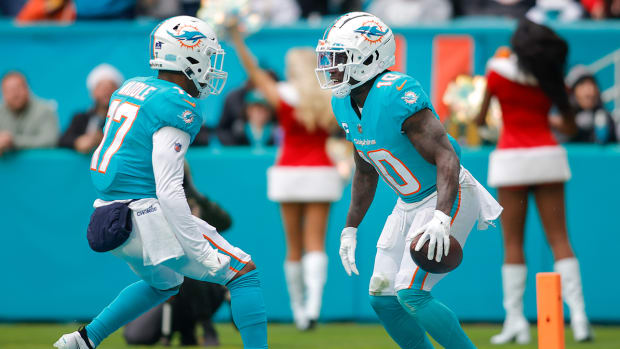 Miami Dolphins wide receiver Tyreek Hill (10) celebrates with wide receiver Jaylen Waddle (17).
