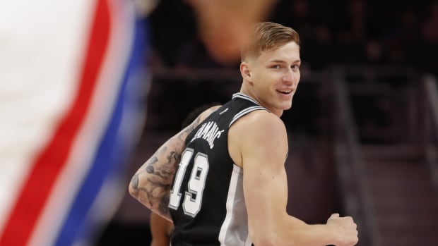 San Antonio Spurs forward Luka Samanic (19) smiles after making a shot during the fourth quarter against the Detroit Pistons at Little Caesars Arena.
