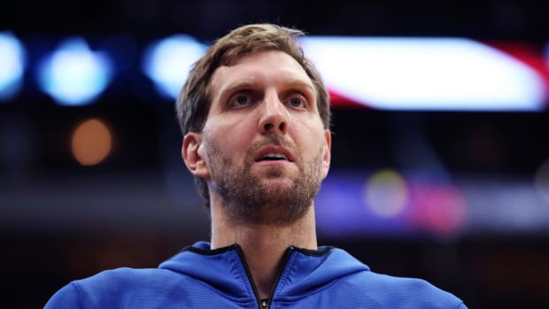 Dallas Mavericks forward Dirk Nowitzki pauses during the national anthem before a 2019 game against the Minnesota Timberwolves