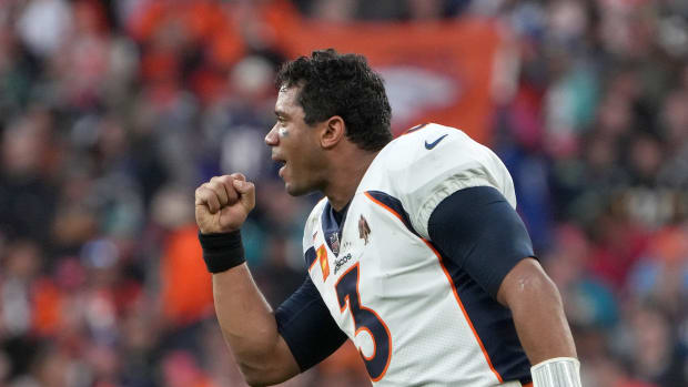 Denver Broncos quarterback Russell Wilson (3) celebrates after a touchdown in the fourth quarter against the Jacksonville Jaguars during an NFL International Series game at Wembley Stadium. The Broncos defeated the Jaguars 21-17.