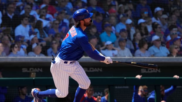 Mar 27, 2023; Mesa, Arizona, USA; Chicago Cubs shortstop Dansby Swanson (7) hits a home run against the Chicago White Sox in the second inning at Sloan Park. Mandatory Credit: Rick Scuteri-USA TODAY Sports