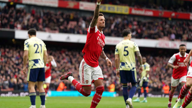 Ben White pictured (center) celebrating after scoring for Arsenal against Leeds in April 2023