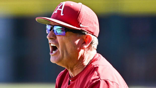 Razorbacks' coach Dave Van Horn yelling at home plate umpire Mark Winters during the eighth inning of a 9-6 win Saturday afternoon.