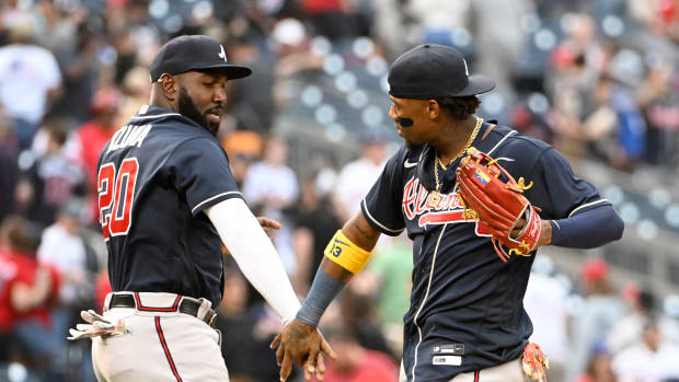 Apr 1, 2023; Washington, District of Columbia, USA; Atlanta Braves right fielder Ronald Acuna Jr. (13) and designated hitter Marcell Ozuna (20) celebrate after the game against the Washington Nationals at Nationals Park. Mandatory Credit: Brad Mills-USA TODAY Sports