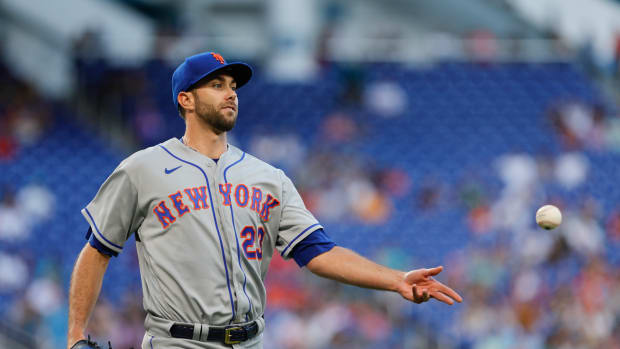 Mar 31, 2023; Miami, Florida, USA; New York Mets starting pitcher David Peterson (23) tosses the baseball to first baseman Pete Alonso (not pictured) to retire Miami Marlins center fielder Jazz Chisholm Jr. (not pictured) during the first inning at loanDepot Park.