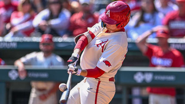 Razorbacks' Brady Slavens connects on a pitch against Alabama in Sunday's series-ending game.
