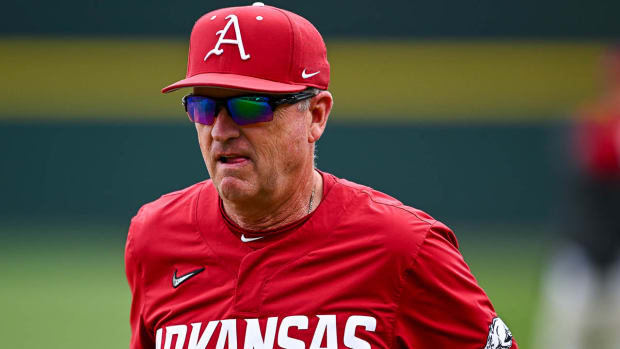 Razorbacks coach Dave Van Horn walks off the field after a 5-4 win over Alabama on Sunday afternoon.
