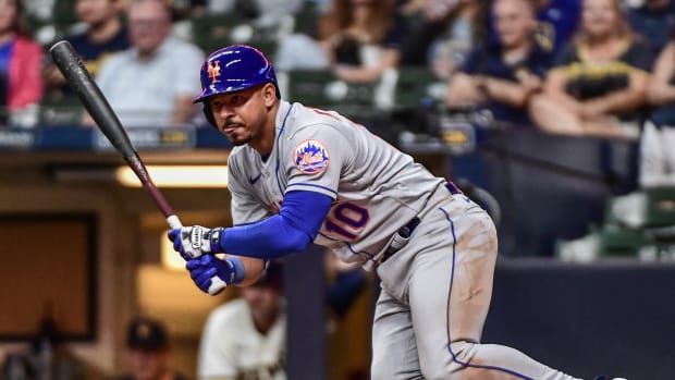 Sep 19, 2022; Milwaukee, Wisconsin, USA; New York Mets third baseman Eduardo Escobar (10) hits a double in the seventh inning against the Milwaukee Brewers at American Family Field.