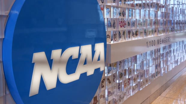 An NCAA logo on a wall showing all of the member schools logos as well