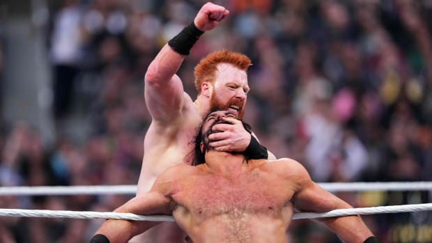 WWE's Sheamus delivers blows to the chest of Drew McIntyre at WrestleMania