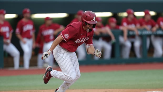 Alabama outfielder Tommy Seidl (20) runs to first in the Crimson Tide's 10-2 win over the Troy Trojans on April 4, 2023 at Sewell-Thomas Stadium in Tuscaloosa, Ala.