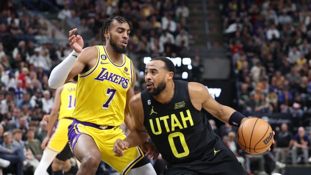Utah Jazz guard Talen Horton-Tucker (0) drives against Los Angeles Lakers forward Troy Brown Jr. (7) in the second quarter at Vivint Arena.