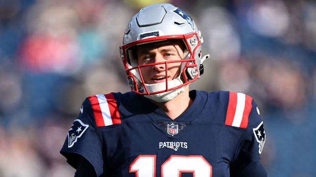 New England Patriots quarterback Mac Jones wearing a helmet