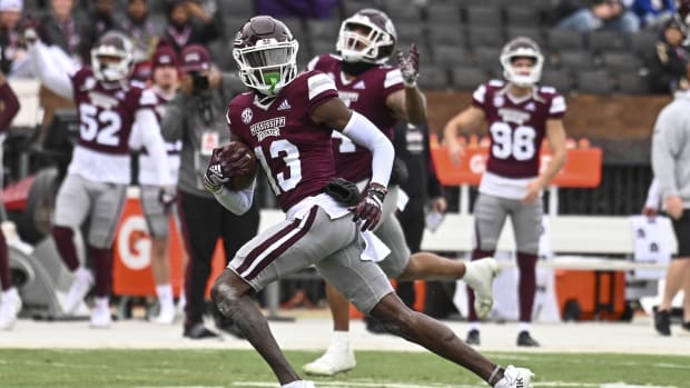 Nov 19, 2022; Starkville, Mississippi, USA; Mississippi State Bulldogs cornerback Emmanuel Forbes (13) returns an interception for a touchdown against the East Tennessee State Buccaneers during the second quarter at Davis Wade Stadium at Scott Field.