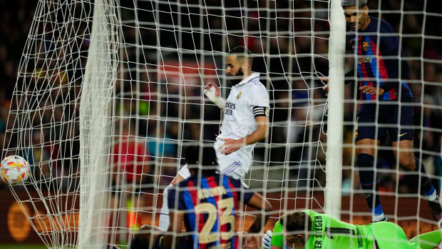 Real Madrid striker Karim Benzema pictured (center) kicking the ball into the back of the Barcelona net during their Copa del Rey semi-final second leg in April 2023