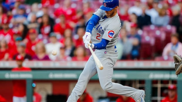 Apr 3, 2023; Cincinnati, Ohio, USA; Chicago Cubs center fielder Cody Bellinger (24) hits a three-run home run in the first inning against the Cincinnati Reds at Great American Ball Park. Mandatory Credit: Katie Stratman-USA TODAY Sports