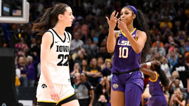 LSU’s Angel Reese points to her finger in front of Iowa’s Caitlin Clark in the NCAA women’s championship game.