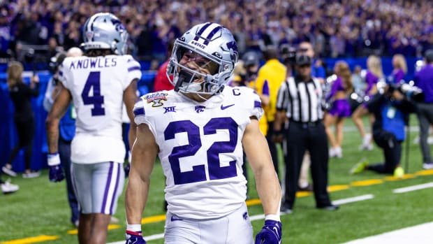 Dec 31, 2022; New Orleans, LA, USA; Kansas State Wildcats running back Deuce Vaughn (22) celebrates his touchdown scored against the Alabama Crimson Tide during the first half in the 2022 Sugar Bowl at Caesars Superdome. Mandatory Credit: Stephen Lew-USA TODAY Sports