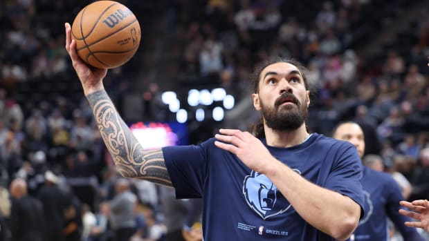 Grizzlies forward Steven Adams holds a basketball during warmups before a game.