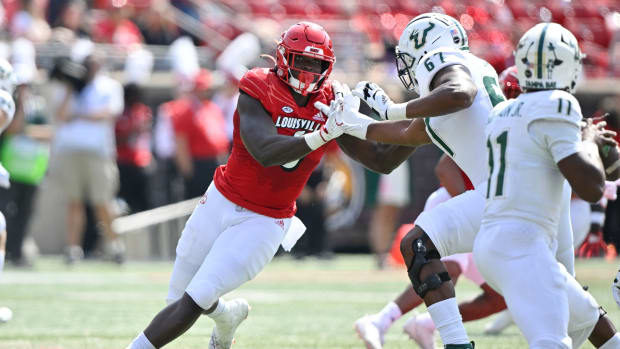 Sep 24, 2022; Louisville, Kentucky, USA; Louisville Cardinals defensive lineman YaYa Diaby (6) pushes past the block of South Florida Bulls offensive lineman Demontrey Jacobs (67) during the second quarter at Cardinal Stadium. Louisville defeated South Florida 41-3. Mandatory Credit: Jamie Rhodes-USA TODAY Sports