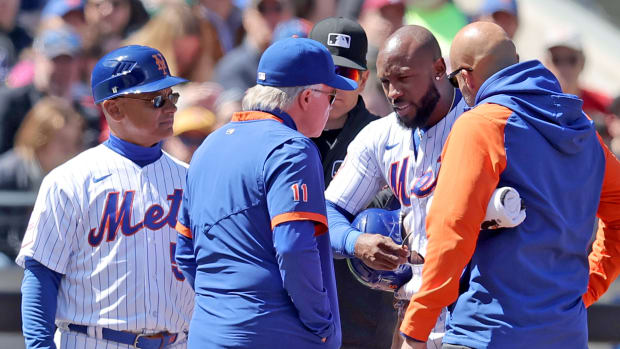 Apr 9, 2023; New York City, New York, USA; New York Mets right fielder Starling Marte (6) talks to manager Buck Showalter (11) during an injury time out during the first inning against the Miami Marlins at Citi Field. Marte came out of the game after the inning.