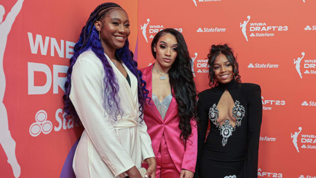 Former South Carolina Gamecocks Aliyah Boston, Brea Beal and Zia Cooke pose in front of an orange wall at the 2023 WNBA draft