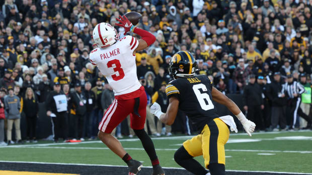 Nov 25, 2022; Iowa City, Iowa, USA; Nebraska Cornhuskers wide receiver Trey Palmer (3) catches a touchdown in front of Iowa Hawkeyes defensive back TJ Hall (6) at Kinnick Stadium. Mandatory Credit: Reese Strickland-USA TODAY Sports