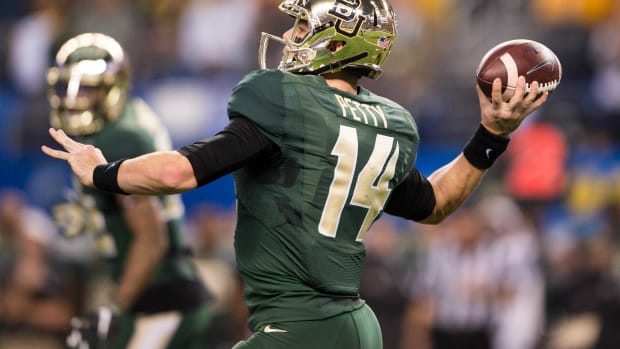 Jan 1, 2015; Arlington, TX, USA; Baylor Bears quarterback Bryce Petty (14) passes against the Michigan State Spartans in the 2015 Cotton Bowl Classic at AT&T Stadium. The Spartans defeated the Bears 42-41. Mandatory Credit: Jerome Miron-USA TODAY Sports