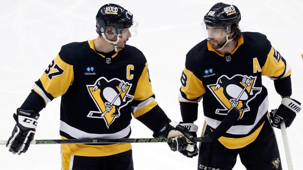 Pittsburgh Penguins center Sidney Crosby (87) and Pittsburgh Penguins defenseman Kris Letang (58).