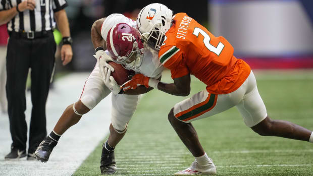 Sep 4, 2021; Atlanta, Georgia, USA; Alabama Crimson Tide running back Jase McClellan (21) is knocked out of bounds by Miami Hurricanes cornerback Tyrique Stevenson (2) during the second half at Mercedes-Benz Stadium. Mandatory Credit: Dale Zanine-USA TODAY Sports