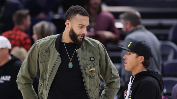 Minnesota Timberwolves center Rudy Gobert (left) speaks with Utah Jazz owner Ryan Smith after a game at Vivint Arena.