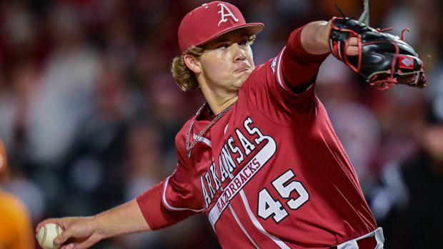 Razorbacks relief pitcher Gage Wood throws a pitch will closing last three innings in win over Tennessee.