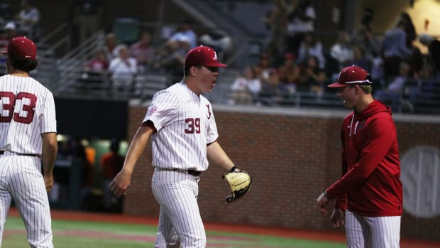 Alabama RHP Garrett McMillan (39) walks off the field with excitement in the Crimson Tide's 4-2 win over the Auburn Tigers on April 15, 2023 at Sewell-Thomas Stadium in Tuscaloosa, Ala.