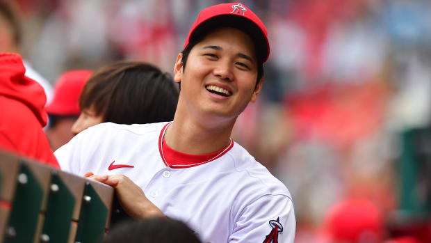 Los Angeles Angels designated hitter Shohei Ohtani smiles in the dugout. (2023)