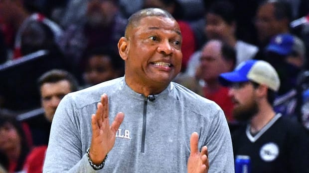 76ers coach Doc Rivers speaks with a referee during Game 1 of the first round of the 2023 NBA playoffs.