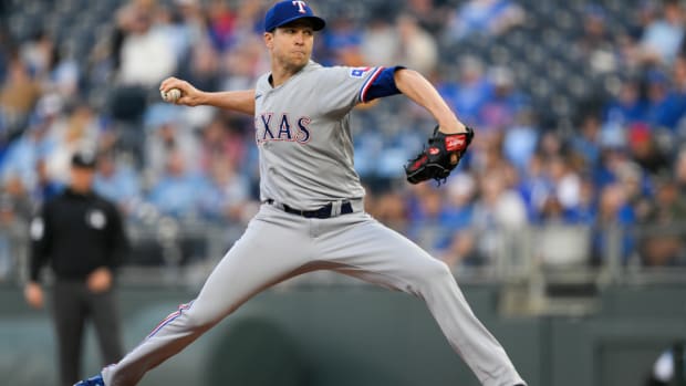 Texas Rangers starting pitcher Jacob deGrom throws to a Kansas City Royals batter during the first inning of a baseball game, Monday, April 17, 2023, in Kansas City, Mo. (AP Photo/Reed Hoffmann)