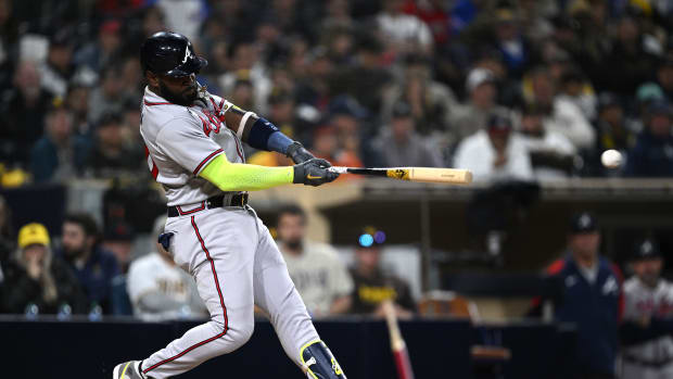 Apr 17, 2023; San Diego, California, USA; Atlanta Braves designated hitter Marcell Ozuna (20) hits a double during the fifth inning against the San Diego Padres at Petco Park. Mandatory Credit: Orlando Ramirez-USA TODAY Sports