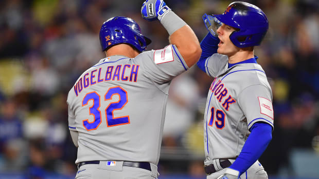 Apr 17, 2023; Los Angeles, California, USA; New York Mets designated hitter Daniel Vogelbach (32) is greeted by left fielder Mark Canha (19) after hitting a two run home run against the Los Angeles Dodgers during the second inning at Dodger Stadium.