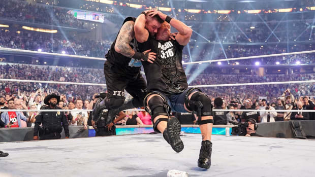 Stone Cold Steve Austin delivers a stunner to Kevin Owens