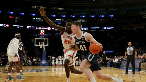 Mar 8, 2023; New York, NY, USA; Butler Bulldogs guard Simas Lukosius (41) drives to the basket against St. John's Red Storm forward Esahia Nyiwe (22) during the first half at Madison Square Garden. Mandatory Credit: Brad Penner-USA TODAY Sports