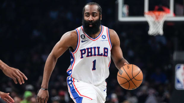 76ers guard James Harden dribbles the ball during a playoff game against the Nets.