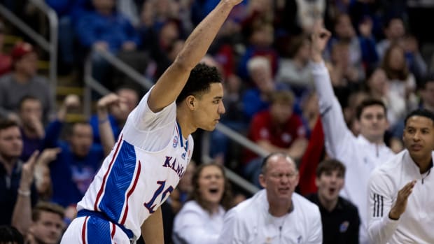 Mar 9, 2023; Kansas City, MO, USA; Kansas Jayhawks guard Kevin McCullar Jr. (15) celebrates a made three-point attempt against the West Virginia Mountaineers in the second half at T-Mobile Center. Mandatory Credit: Amy Kontras-USA TODAY Sports