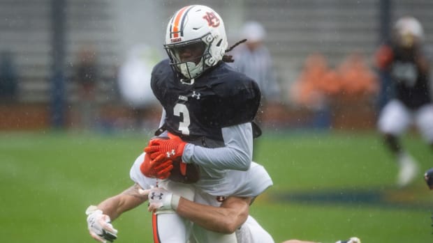 Auburn Tigers wide receiver Tar'Varish Dawson Jr. (3) is taken down after making a long catch during the A-Day spring football game at Jordan-Hare Stadium in Auburn, Ala., on Saturday, April 8, 2023.