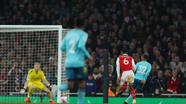 Theo Walcott pictured (right) scoring for Southampton against Arsenal in April 2023